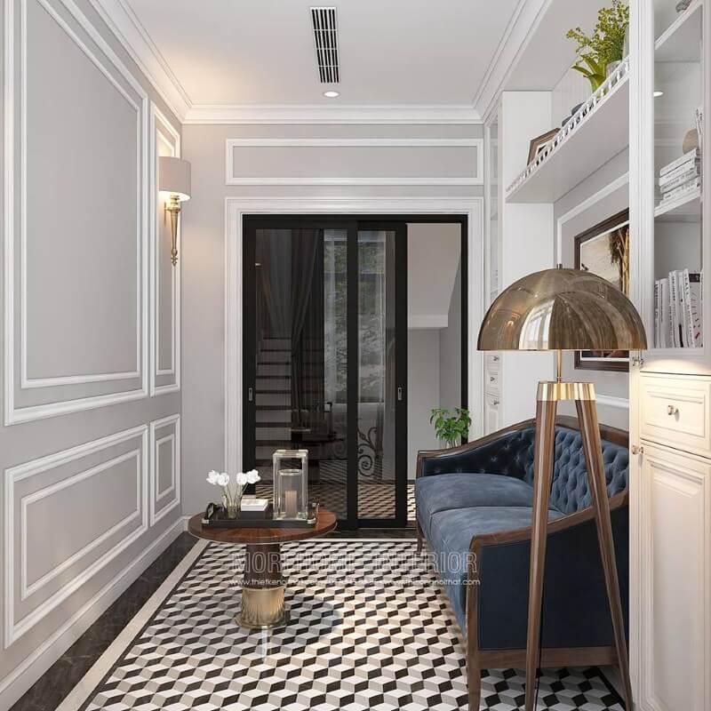Gạch lát nền giả cổ, sofa văng gỗ óc chó tân cổ điển bọc nệm xanh cùng tường trắng đơn sắc đã tạo nên không gian đẹp sang trọng, đáp ứng tối đa công năng cho phòng đọc sách. Mẫu nội thất biệt thự tân cổ điển