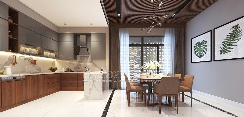 Thiết kế nội thất phòng bếp liền phòng ăn sang trọng, độc đáo với nội thất gỗ chủ đạo từ tủ bếp, bộ bàn ghế, tường ốp gỗ tại biệt thự, nhà phố Vinh, Nghệ An. Thiết kế phòng ăn biệt thự